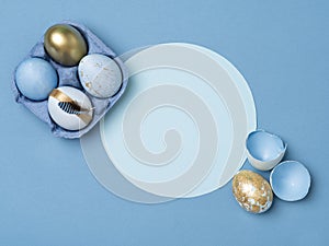 Blue and gold Easter eggs in layout.