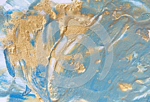 Blue and gold liquid texture. Hand drawn marbling background. Ink marble abstract pattern