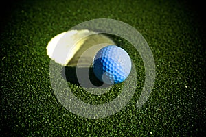 Blue golf ball golf course hole