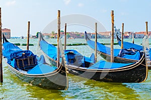 Blue gondolas moored in Venice, Italy