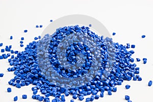 Blue granules of polypropylene, polyamide. White background. Plastic and polymer industry. Microplastic products.