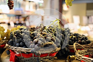 blue grapes in wicker baskets