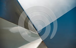 blue and gray abstract background from curved lines of geometric shapes
