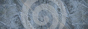 Blue gray abstract background. Stone background. Toned rock texture. Marble effect. Panorama.