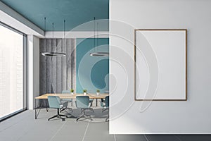 Blue and gray office meeting room with poster