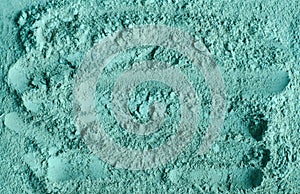 Blue, green bentonite clay powder alginate, facial mask, eye shadow, body wrap texture close up, selective focus.