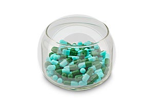 Blue and green capsule of antibiotic in a bottle