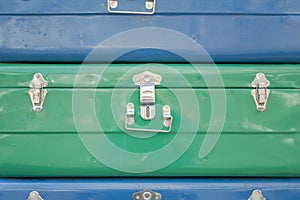Blue and green chests with accessories close-up. rough surface texture