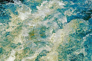 Blue and green churning water abstract