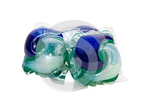 Blue green gel capsules for washing clothes isolated on the white background