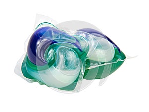 Blue green gel capsules for washing clothes isolated on the white background