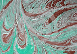 Blue, green and gold liquid texture. Hand drawn marbling background. Ink marble abstract pattern. Design, nature.
