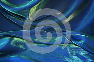 Blue, green and gold silk fabric texture background