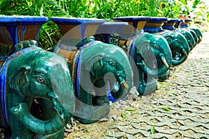 Blue and green grossy textured stone elephant chairs