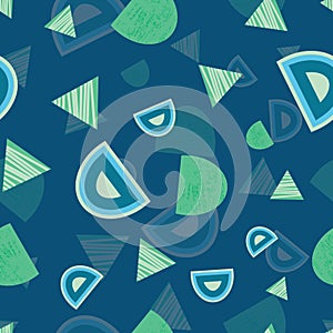 Blue, green, navy triangles, circles, hexagons shapes on blue background seamless pattern.