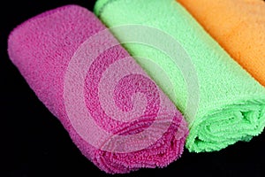 Blue, green, orange and pink microfiber cleaning cloths,