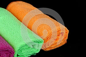 Blue, green, orange and pink microfiber cleaning cloths,