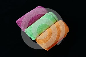 Blue, green, orange and pink microfiber cleaning cloths,