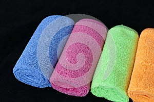 Blue, green, orange and pink microfiber cleaning cloths,