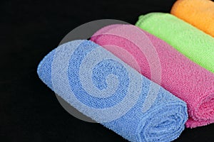 Blue, green, orange and pink microfiber cleaning cloths,