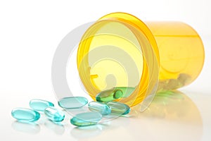 Blue Green Pills with Prescription Bottle