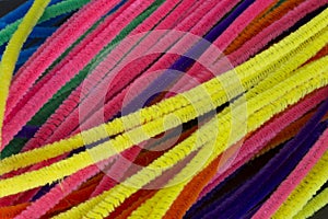 Blue,Green,Purple,Orange,Pink and Yellow pipe cleaners background