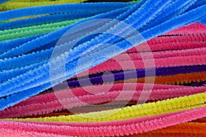 Blue,Green,Purple,Orange,Pink and Yellow pipe cleaners background