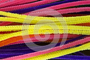 Blue,Green,Purple,Orange,Pink and Yellow pipe cleaners background