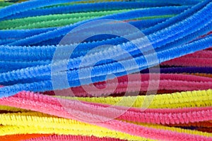 Blue,Green,Purple,Orange,Pink and Yellow pipe cleaners background