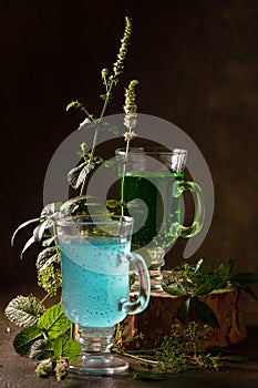 Blue and green refreshing drinks with fresh mint