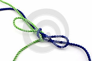 Blue and green ropes tied in a bow, isolated