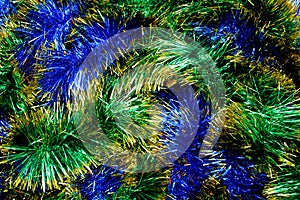 Blue and green shiny christmas tinsel texture for decoration