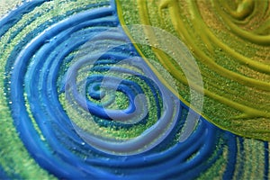 Blue and green swirl drawn with acrylic paint. Abstract background.