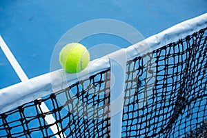 Blue and green tennis court surface,Tennis ball on the field