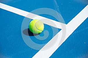 Blue and green tennis court surface,Tennis ball on the field