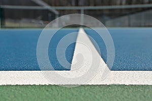 Blue and green tennis, paddle ball, pickleball court sports and recreation concept