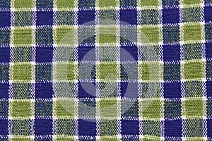 blue and green textile checkered fabric napkin , tablecloth texture closeup view, background, copy space, horizontal