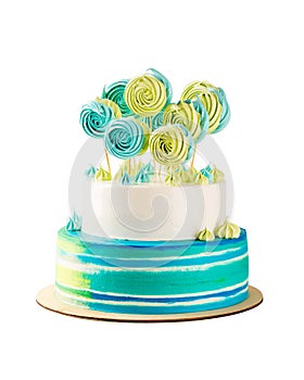 Blue and green tiered birthday cake isolated on white