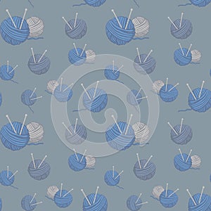 Blue and grey of balls of thread knitting needles on grey background seamless pattern. Knitting