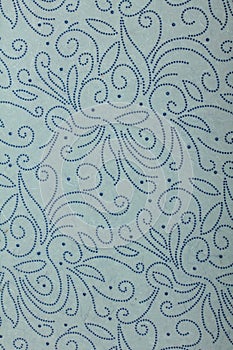 Blue-grey handmade art paper with dotted twirls photo