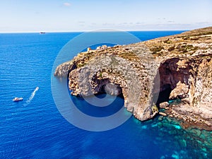 Blue Grotto in Malta. Aerial top view from Mediterranean sea island of birds