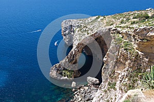 Blue Grotto in Malta, Zurieq, tourist destination in Malta, view to Blue grotto on nice calm sunny summer day, holidays in Malta