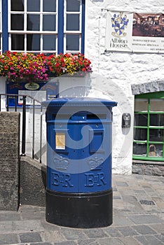 Blue Guernsey Post Box unique to Guernsey in the town of St Pierre Port St Peter Port, the main settlement of Guernsey, The