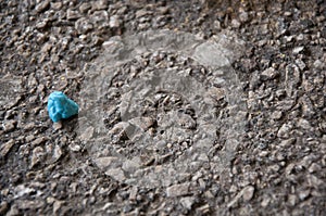 Blue gum wad on pebbled street photo