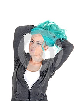 Blue hair woman messing up hair.