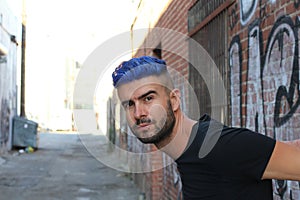 Blue haired guy walk on old rusty forsaken barges photo