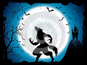 Blue Halloween background with castle and werewolf photo