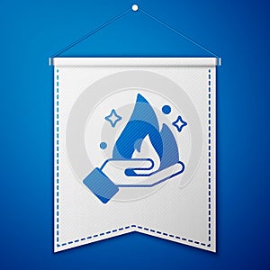 Blue Hand holding a fire icon isolated on blue background. White pennant template. Vector