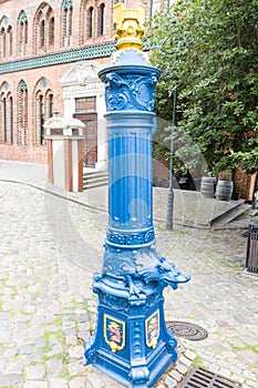 Blue hand water pump in Stettin, Poland