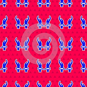 Blue Handcuffs on hands of criminal man icon isolated seamless pattern on red background. Arrested man in handcuffs. A